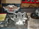2004 Yamaha YFZ450 - Engine cylinder head disassembled, with a Harley-Davidson box visible behind it.