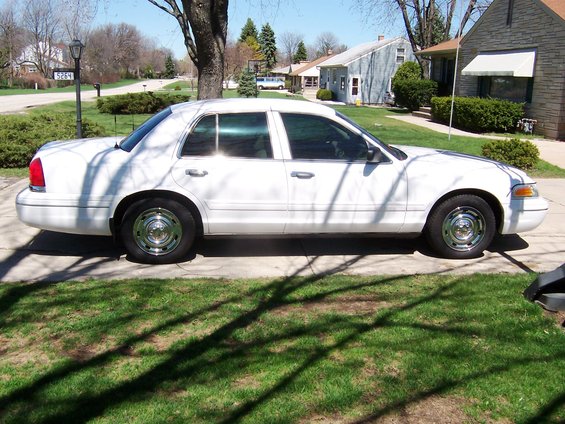 White 2003 Ford Crown Victoria sedan, side view