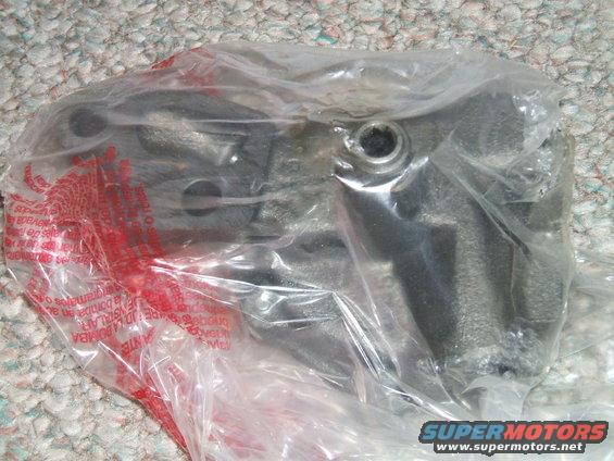 Oil pump in plastic packaging with red warning text