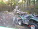 1988 Jeep Comanche - A hunter poses with his deer next to a Yamaha Grizzly ATV in a wooded area.