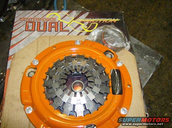 Orange clutch assembly with dual friction plates, part of a Centerforce Dual Friction kit