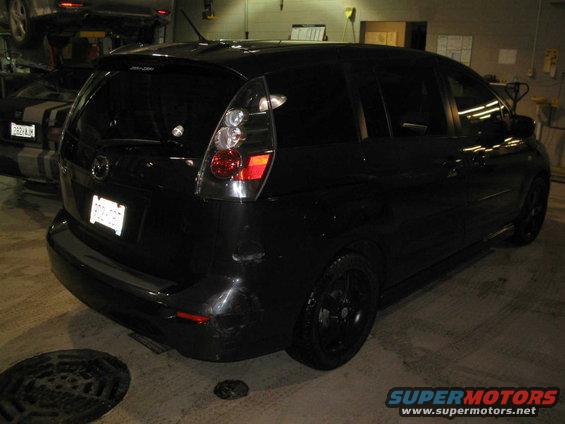 Black 2006 Mazda Mazda 5 parked in a garage, rear view