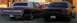 1989 Lincoln Town Car - Rear view of a maroon 1989 Lincoln Town Car next to a black sedan.