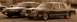 1989 Lincoln Town Car - Two sedans are parked side-by-side, one appearing to be a Lincoln Town Car from the 1980s.