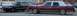 1989 Lincoln Town Car - A maroon 1989 Lincoln Town Car is parked next to a black sedan.