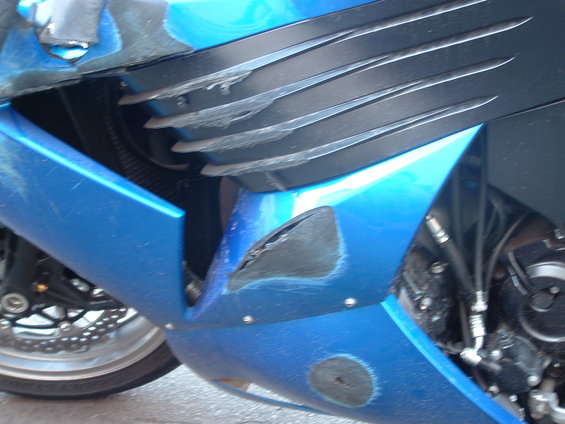 dscf0069.jpg A close up of some of the damage.  I bet the motor is still in good shape.  Makes me wonder about the frame sliders available for this bike and whether or not they would have helped any.