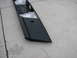 2003 Ford Crown Victoria - A black automotive trim piece with integrated clear lights is shown on a concrete surface.