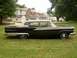 1959 Ford Fairlane - Side view of a black 1959 Ford Fairlane 500 sedan with chrome accents.