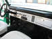 1975 Ford Bronco - Interior view of a 1975 Ford Bronco, showing the dashboard, steering wheel, and seats.
