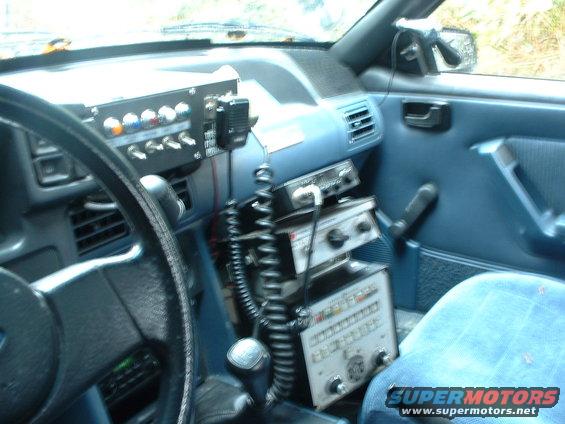 1987 Ford Mustang interior showing dashboard with multiple radio units and a CB microphone