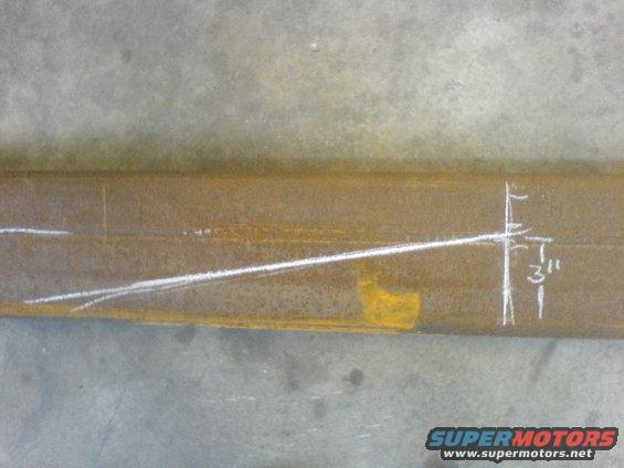 Metal beam with chalk lines and a "3" measurement mark