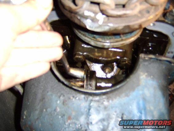 change-oil-pan-gasket-and-valve-cover-gasket-065.jpg I am first unbolting the pickup tube...you need to be a bit af an acrobat to do this.