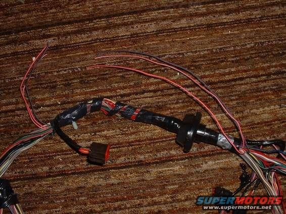 frpp_syp_01.jpg This is a Spy photo I took of a NEW Ford EFI harness.  These 4 wires were cutoff and taped over inside.  Proof that this harness is not designed for EFI swaps, simply a left-overs re-sold to the public.