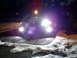 2003 Mercury Marauder - Car with aftermarket lighting modifications seen at night in snowy conditions.
