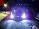 2003 Mercury Marauder - A car is seen from the rear at night, its bright headlights illuminating the road ahead.