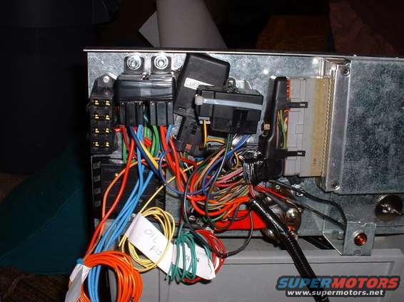 bw_harness_05.jpg (top row from left) EFI fuse block, EFI relay pack, Baro sensor, Self-test plugs, Computer
(bottom row from left) Main vehicle fuse block, Main battery possitive terminal, Starter seloniod, Check engine light