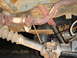 1996 Ford Bronco - Underside view of vehicle's driveshaft, U-joint, and exhaust system components.