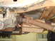 1996 Ford Bronco - Underside view of a vehicle's driveshaft and transmission, showing significant rust.