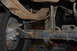 1996 Ford Bronco - Close-up view of a vehicle's rear axle and leaf springs, highlighting the components and their condition.