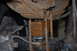 1996 Ford Bronco - Close-up view of a vehicle's rear suspension, showing leaf springs, a block lift kit, and U-bolts.