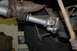 1996 Ford Bronco - Underside view of a vehicle's driveshaft and universal joint assembly.