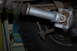 1996 Ford Bronco - Underside view of a vehicle's driveshaft and U-joint assembly, showing wear and some painted components.