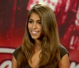 Woman with long brown hair smiling