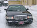 1999 Ford Crown Victoria - Front view of a 1999 Ford Crown Victoria parked in the snow.