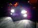 2003 Mercury Marauder - A 2003 Mercury Marauder is seen at night with its lights on, with another vehicle in the background.