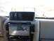 1996 Ford Bronco - The interior features ARB switches for air lockers and compressor, along with a multimedia receiver displaying a Jeep on a trail.