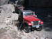 1996 Ford Bronco - Two Jeeps navigate a challenging, rocky off-road trail.