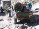 1996 Ford Bronco - Two off-road vehicles navigate a rocky trail, with a Chevrolet pickup truck loaded with a spare tire.