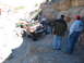 1996 Ford Bronco - A convoy of Jeeps navigates a challenging off-road trail through a canyon.