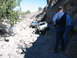 1996 Ford Bronco - Off-roading scene with two Jeeps navigating a difficult rocky path.