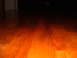 1988 Ford Bronco - Wooden floor with distant headlights visible in the dark.