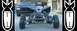 1999 Yamaha WARRIOR - An ATV is parked in front of a pickup truck, with bomb graphics on the sides of the image.