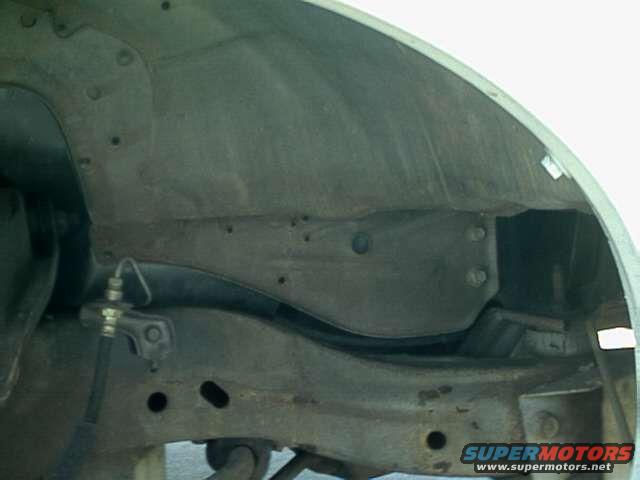 1976 Ford Ranchero wheel well interior showing suspension and brake line