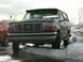 1992 Ford Bronco - This 1992 Ford Bronco is parked in a snowy lot, with its front grille and headlights clearly visible.
