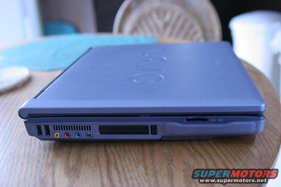 Purple laptop with VAIO logo, side view showing ports