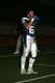 1993 Ford Bronco - A football player pauses during a game on a field, holding a drink.