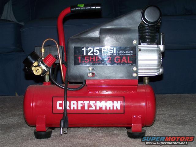 Craftsman air compressor with red tank and silver motor, showing 125 PSI and 2 GAL labels