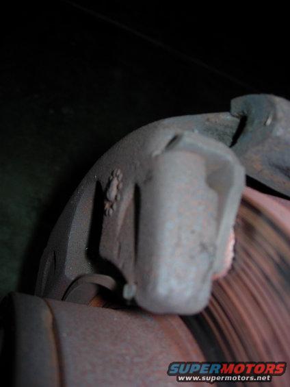 Passengers side disk.   Pads aren't making full contact on both sides of the rotor.