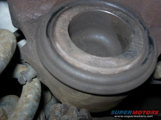 Drivers side caliper piston has some maring but overall good condition.  Rubber seal still soft and functional.