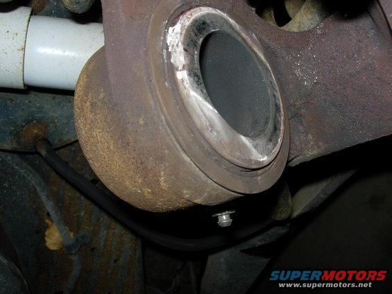 Passenger side caliper.   Seal is flat and hard.  Piston is frozen.
