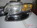 1997 Dodge Grand Caravan - Pair of aftermarket headlights, one clear and one with black housing, are shown.