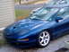 1994 Ford Probe - Blue 1994 Ford Probe GT shows off its custom hood scoop and white racing wheels.