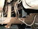 1996 Ford Bronco - Close-up view of the vehicle's undercarriage, highlighting suspension and drivetrain parts.