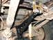 1996 Ford Bronco - This image shows the underside of a vehicle, focusing on modified suspension components like control arms and shock absorbers.