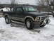 1994 Ford Probe - This black Chevrolet S-10 pickup truck is equipped with a bull bar and fog lights, seen here in a snowy environment.