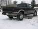 1994 Ford Probe - This black Chevrolet S-10 pickup truck features tan trim and off-road tires, seen parked in a snowy environment.